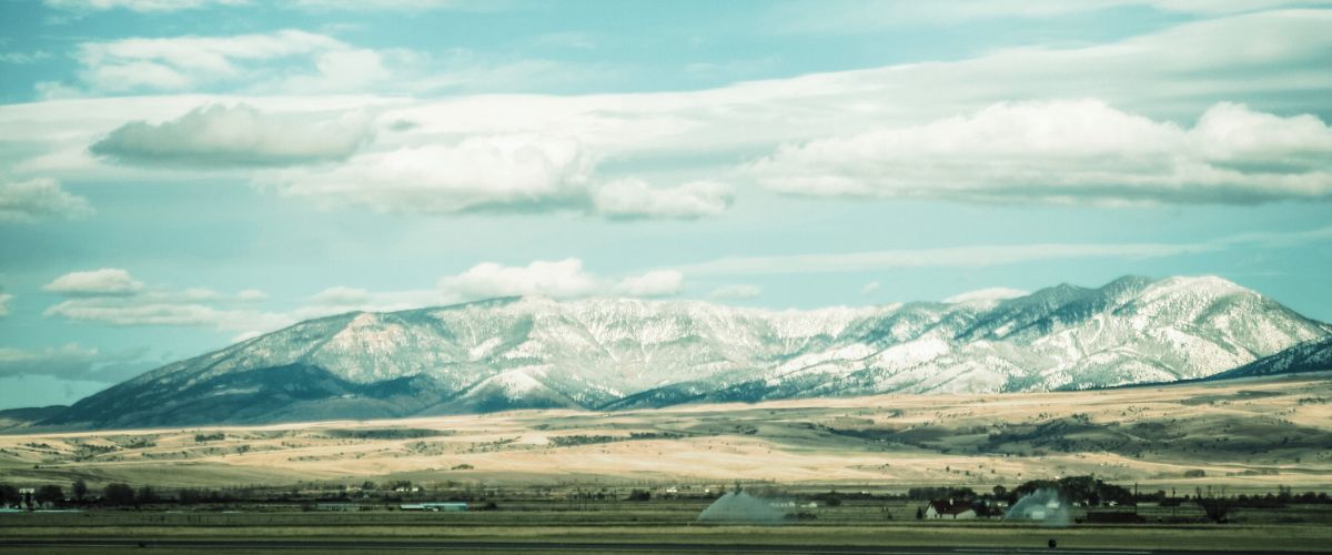 montana mountains stock photo with clouds | A.D. Hegyes indie author living in Montana